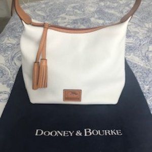 Leather Dooney and Bourke purse with storage bag.